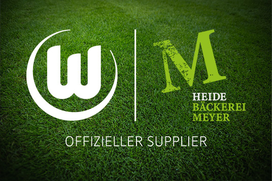 Die Logos des VFL Wolfsburg und der Heidebäckerei Meyer nebeneinander.